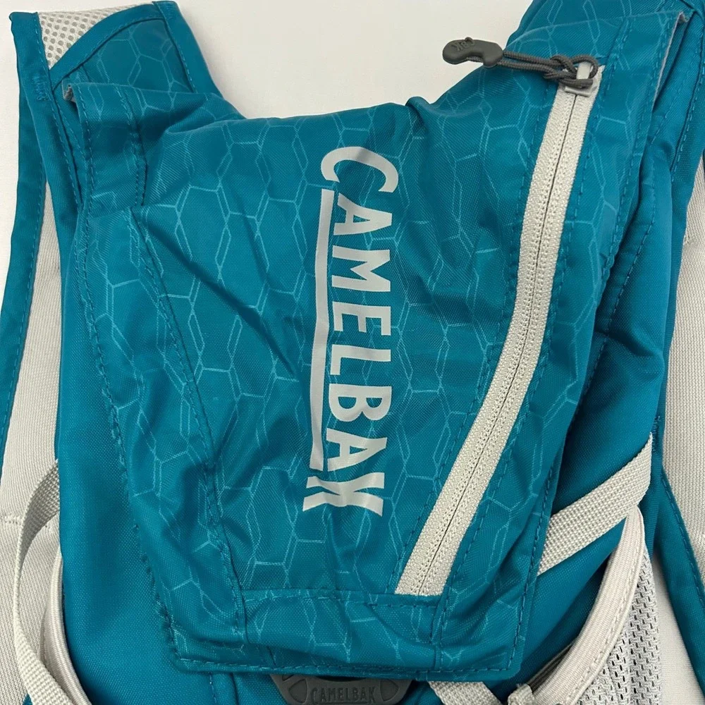 CamelBak Velocity Hydration Pack Teal Blue Reflective Hiking Running Bag 70oz